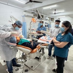 Trainee dentist performing a procedure under supervision